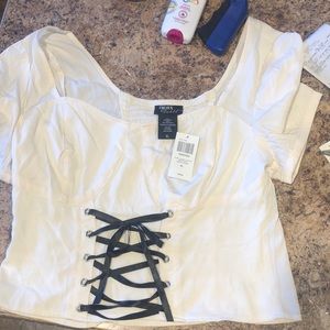 Selling a corseted top, kinda.   cottage-core maybe more pirate-core